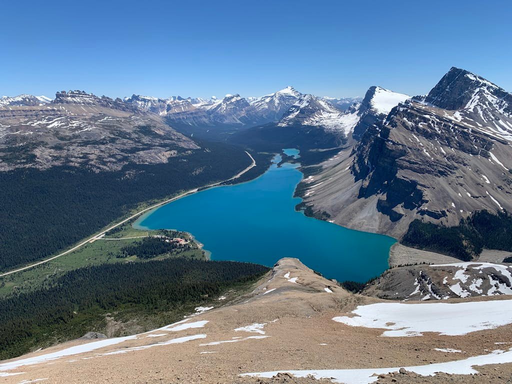 A view of a mountain range with a blue lake