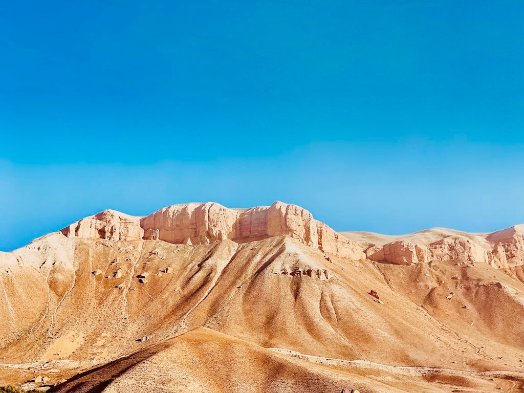 Photo of a Desert, a Mountain Range a Clear Sky